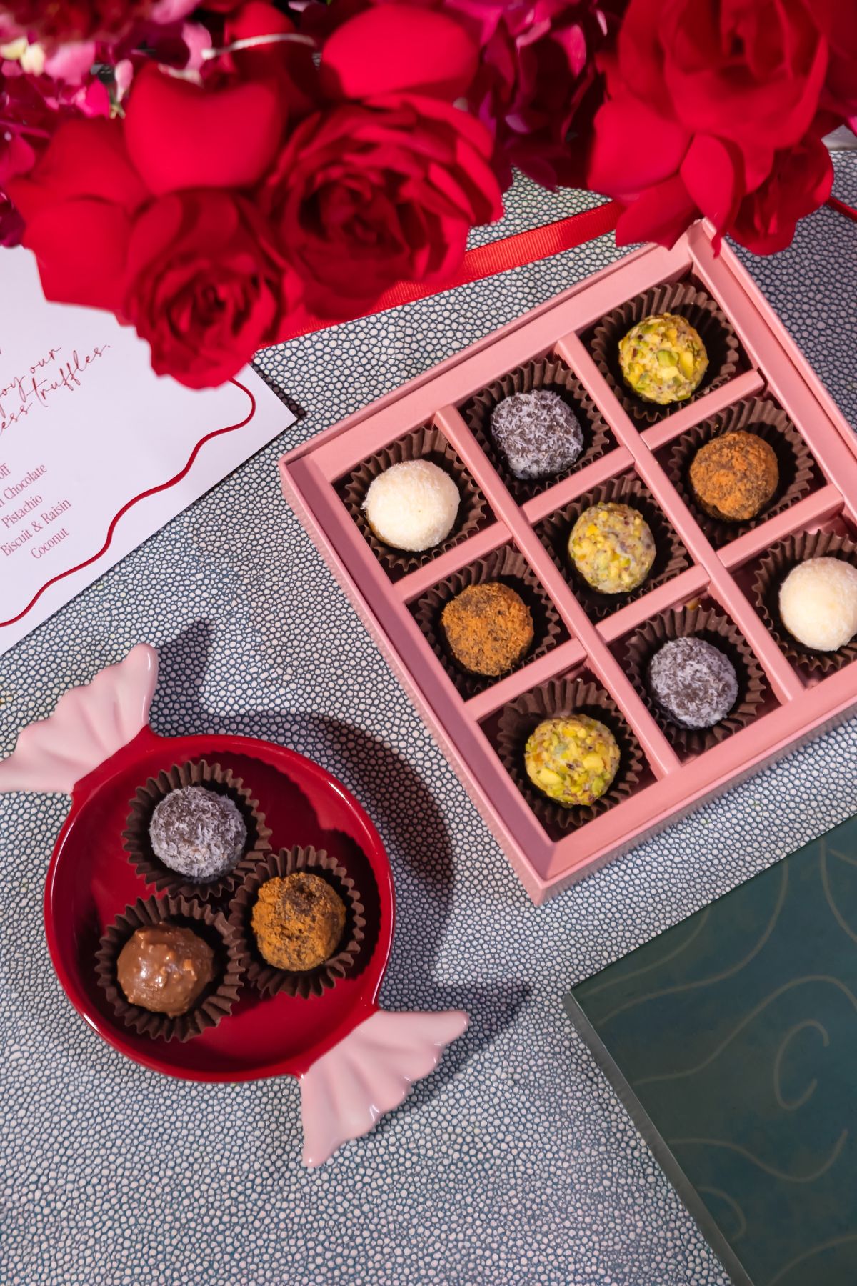 Pink Meette box of chocolates with red roses and a candy-shaped dish